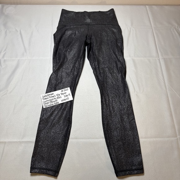 PREOWNED LULULEMON TRAIN TIMES 7/8 PANT LUMINOSITY FOIL SILVER/BLACK SIZE 4 - Picture 1 of 16